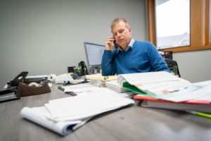 Rich Mueller talking on the phone with an accounting client